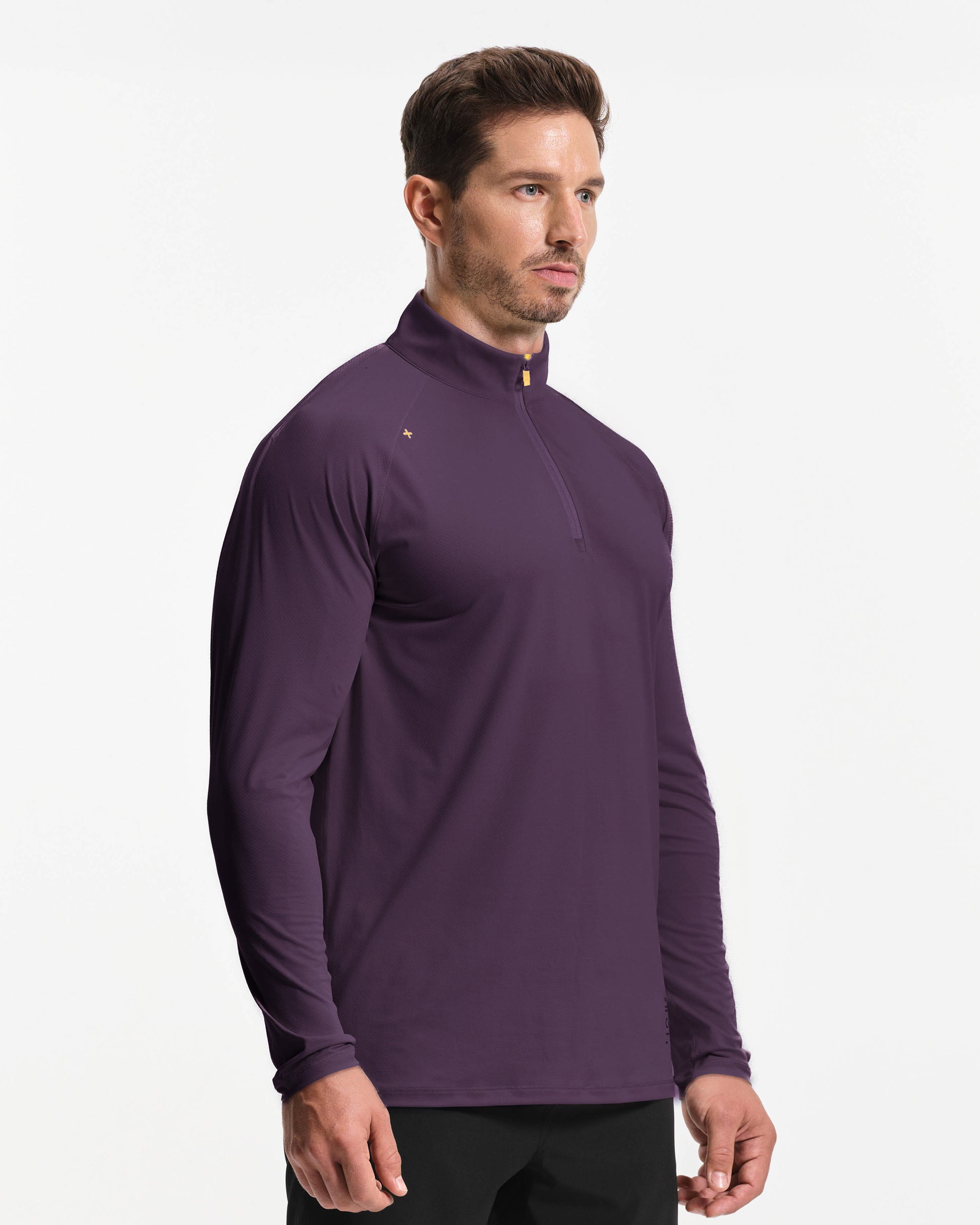 Man wearing a purple long-sleeve athletic shirt on a white background