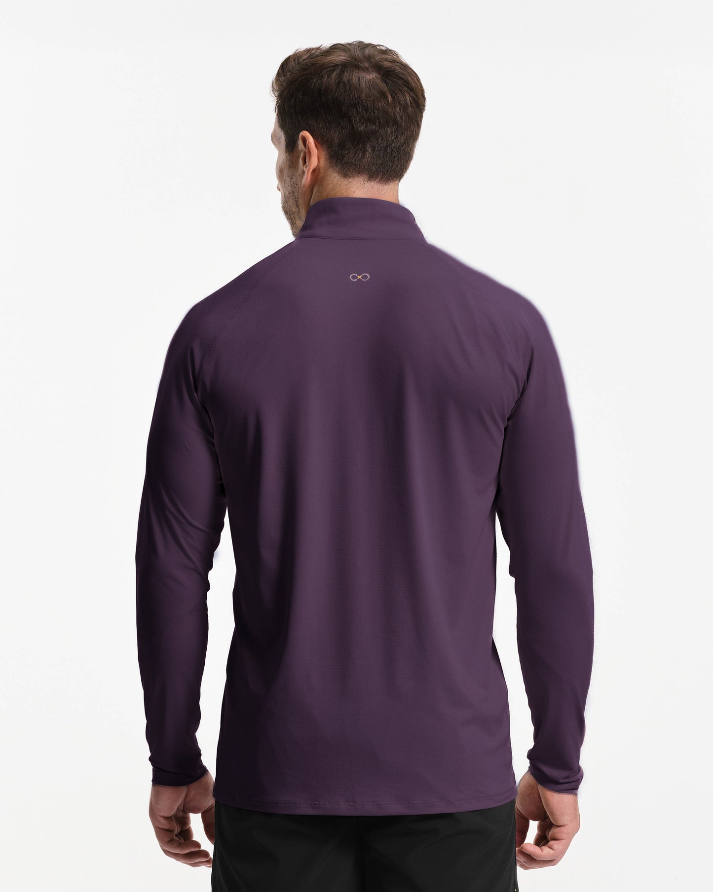 Man wearing a purple long-sleeve shirt on a white background